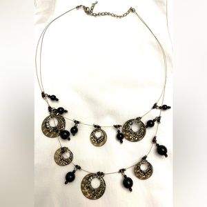Leopard, black, and gold necklace.